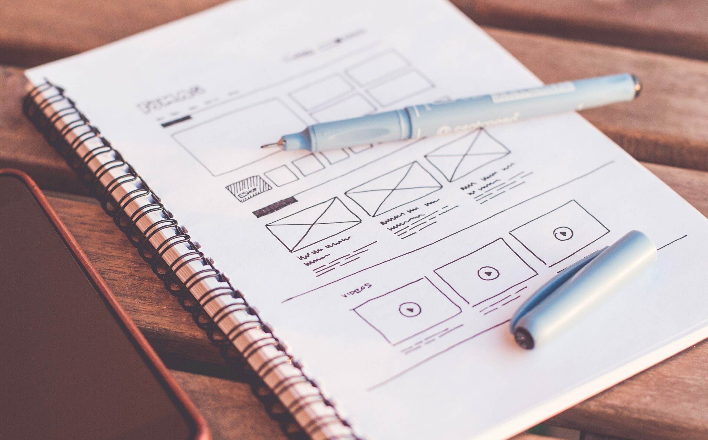 Notebook with website design sitemap sketch